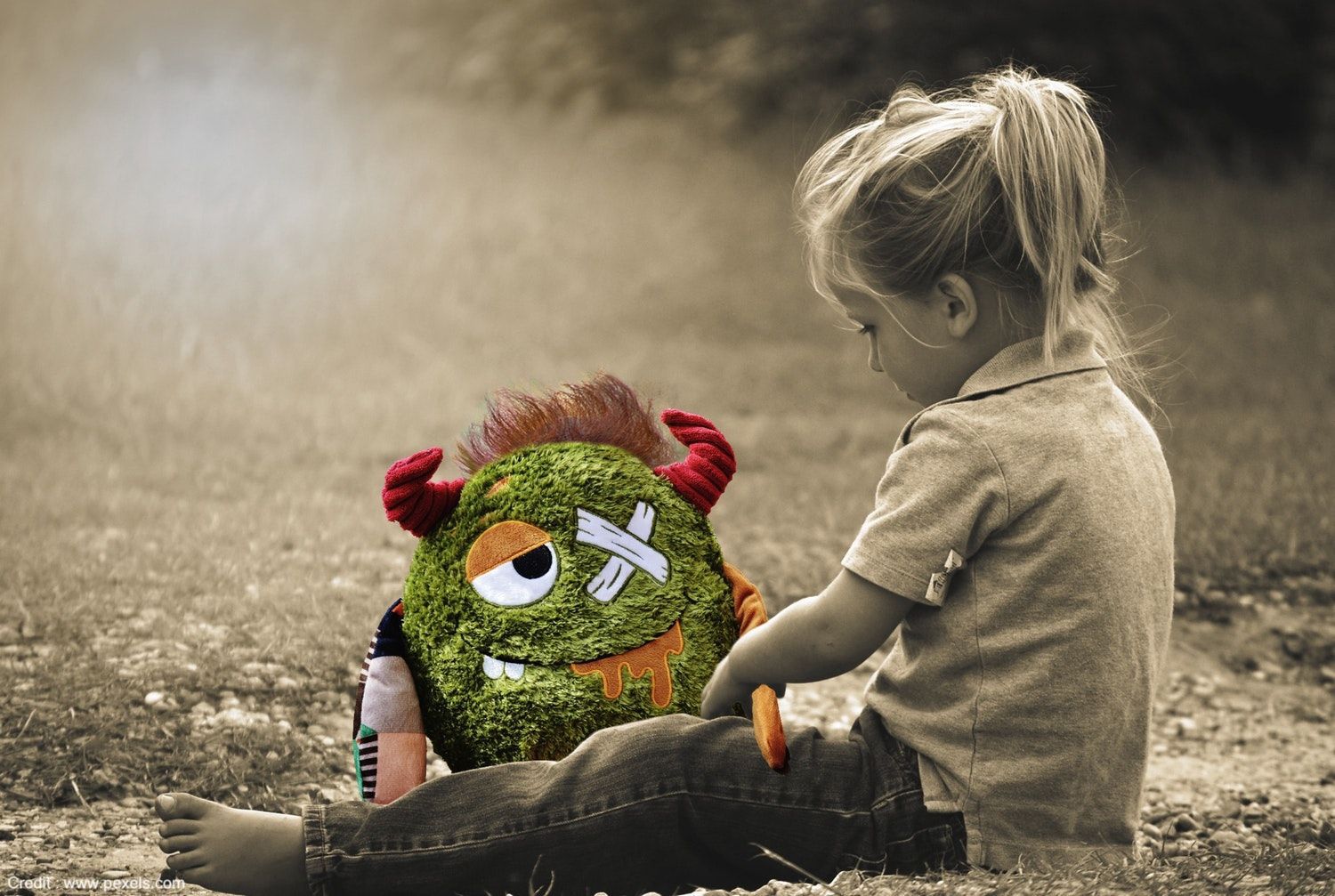Child Playing with Doll - Dealing with the Effects of Childhood Trauma